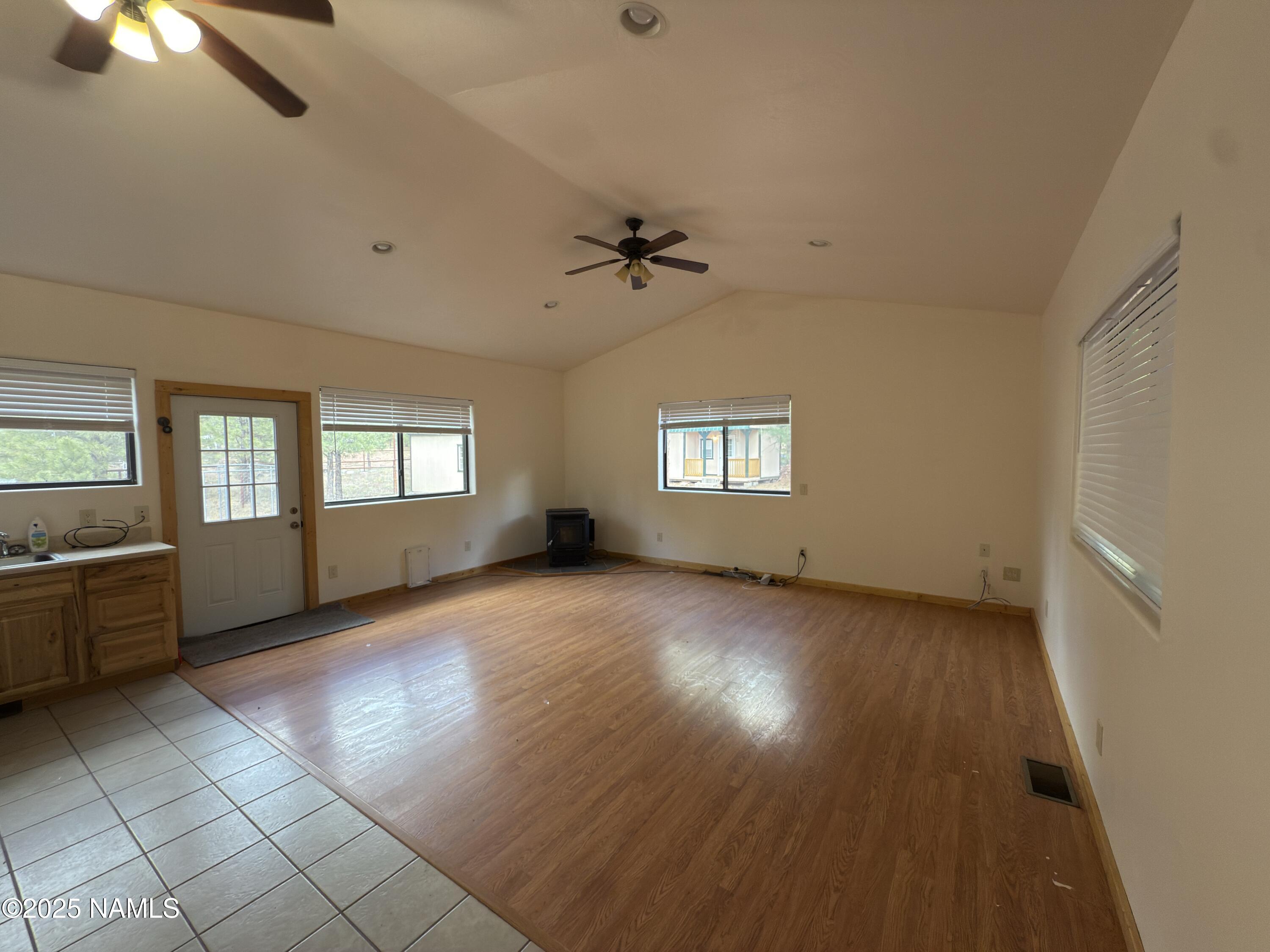 7261 East Long Bow Drive Williams, AZ 86046 - Photo 10 of 43 wooden floor in an empty room with a window