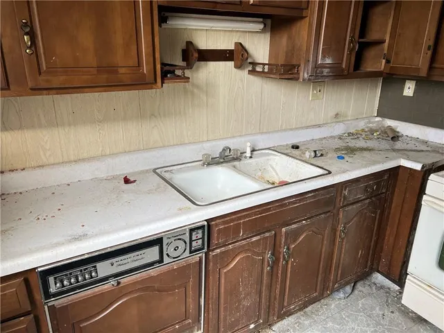 a kitchen with a stove and a sink
