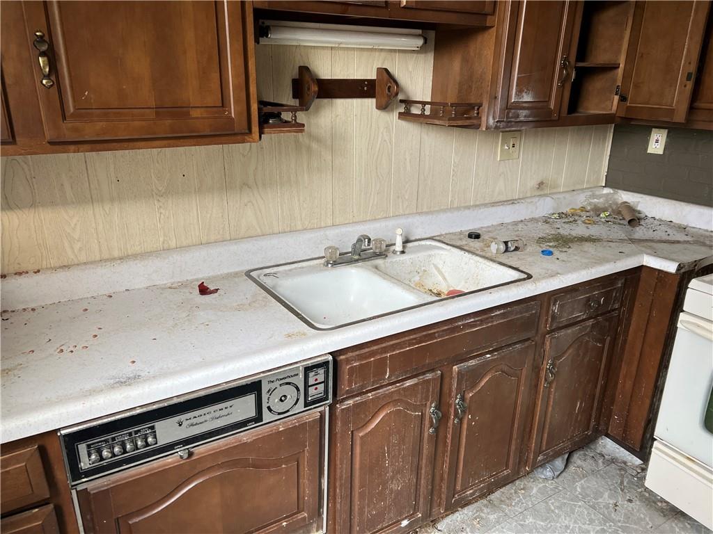 327 3rd Street Leechburg, PA 15656 - Photo 15 of 21 a utility room with stainless steel appliances granite countertop a sink and a stove
