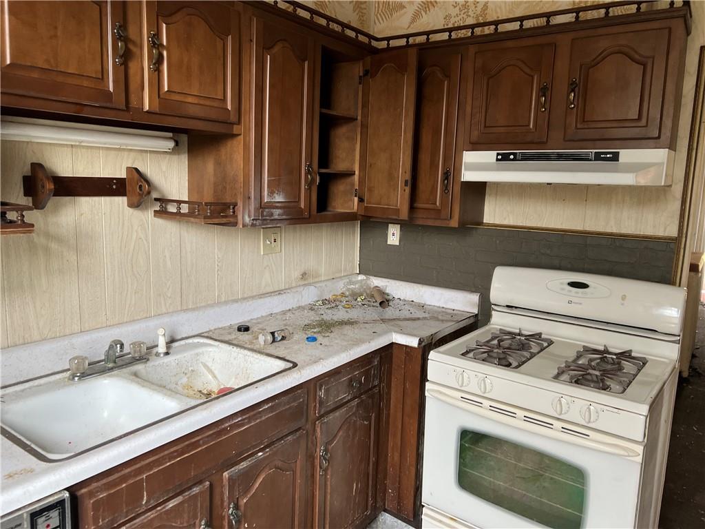 327 3rd Street Leechburg, PA 15656 - Photo 16 of 21 a kitchen with a stove and a sink