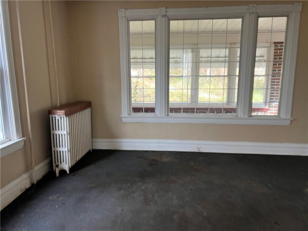 327 3rd Street Leechburg, PA 15656 - Photo 3 of 21 an empty room with wooden floor and windows