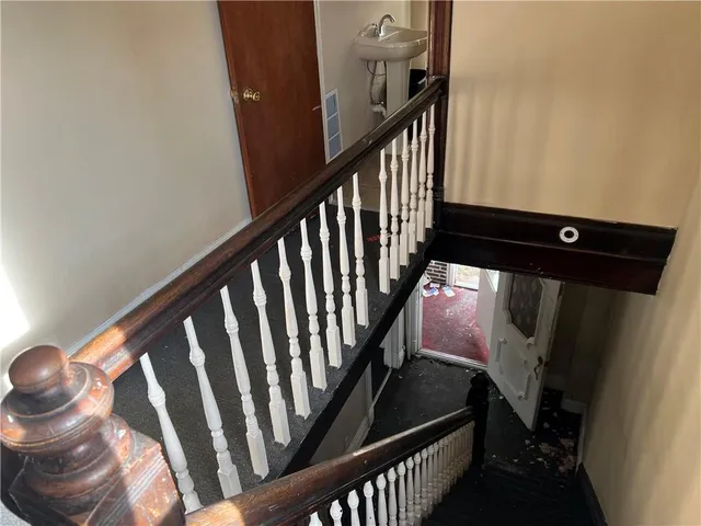 a bedroom with a bed and a flat tv screen