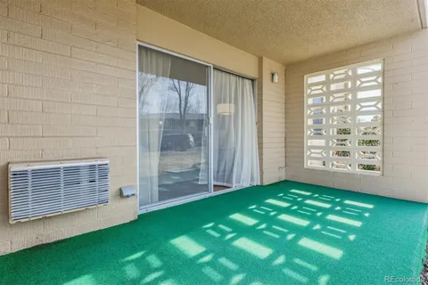 a view of an empty room with windows lake and mountain view