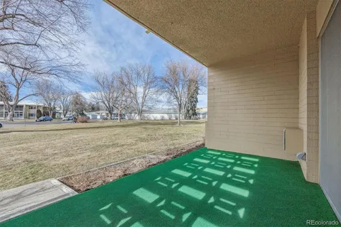 a view of outdoor space with garden and tall buildings