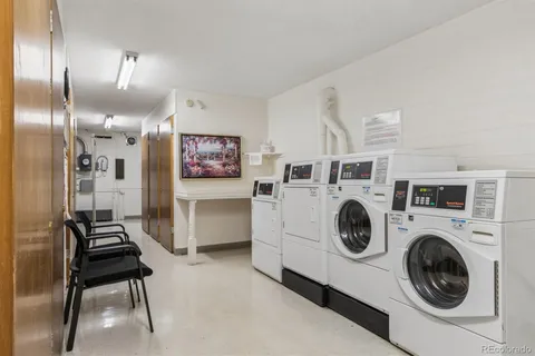 a view of a hallway with washer and dryer