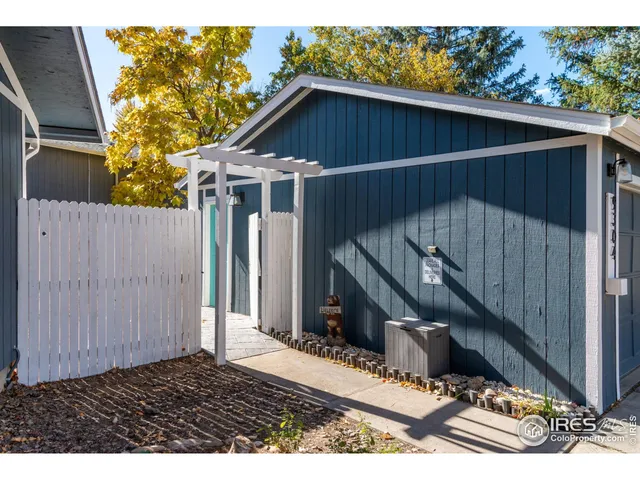 a living room with furniture a rug and a window