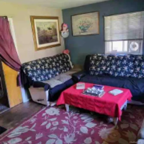 a bedroom with bed and a window