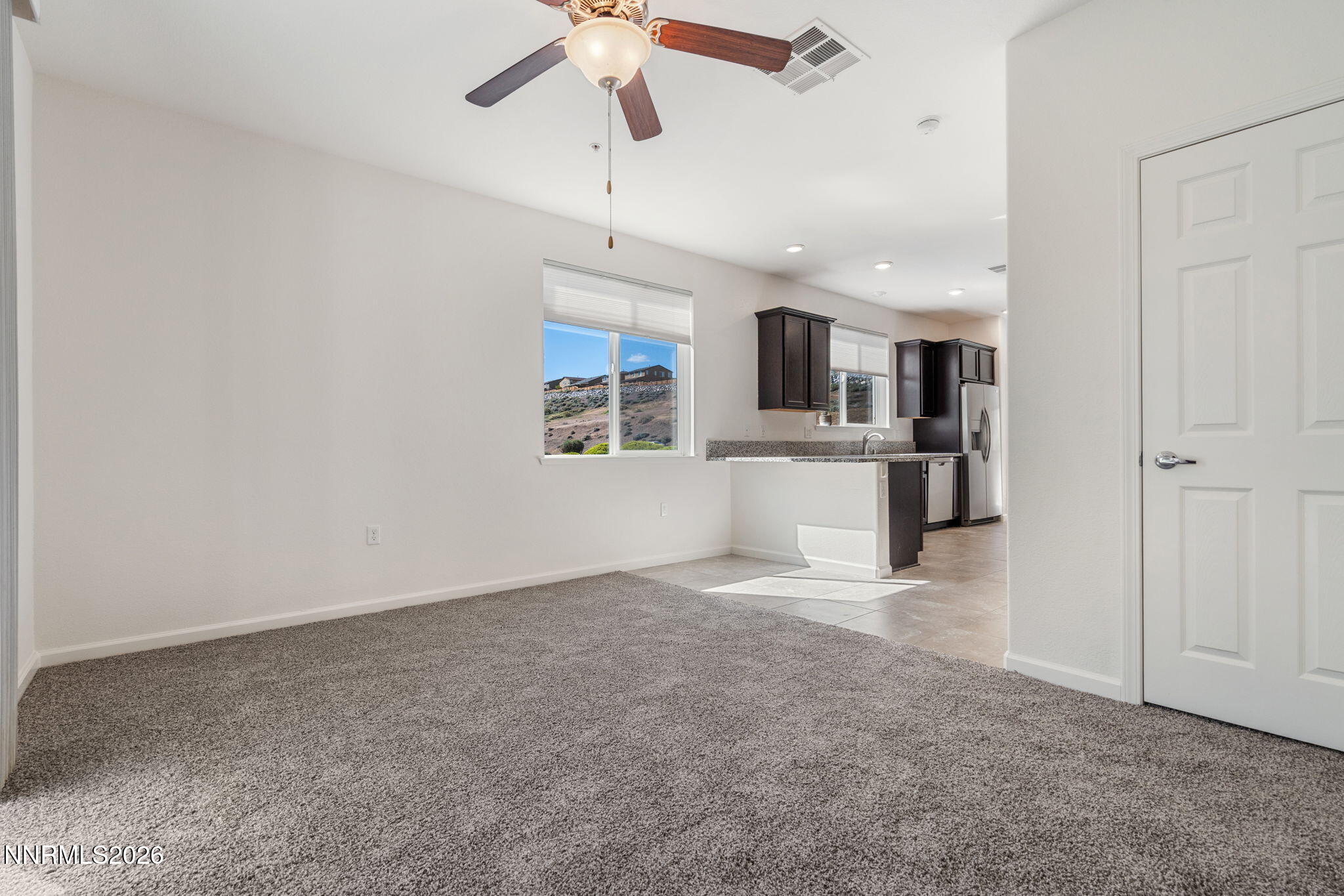 3040 Sterling Ridge Circle Sparks, NV 89431 - Photo 13 of 31 an empty room with a kitchen and a sink