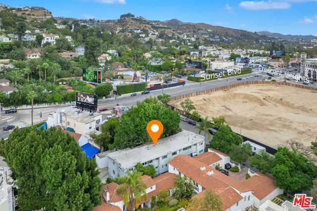 an aerial view of a house with a swimming pool