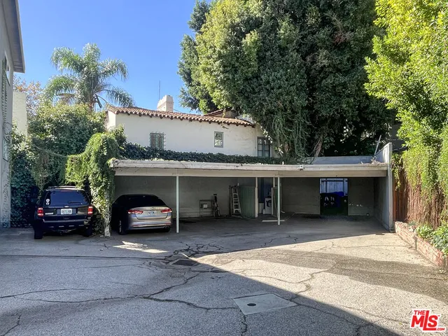 a car parked in front of garage