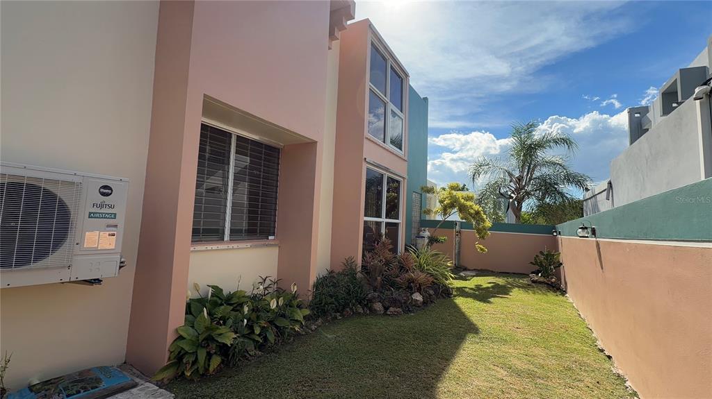 1 St Rio Grande, Unit B6 Rio Grande, PR 00745 - Photo 10 of 47 a view of a house with a yard