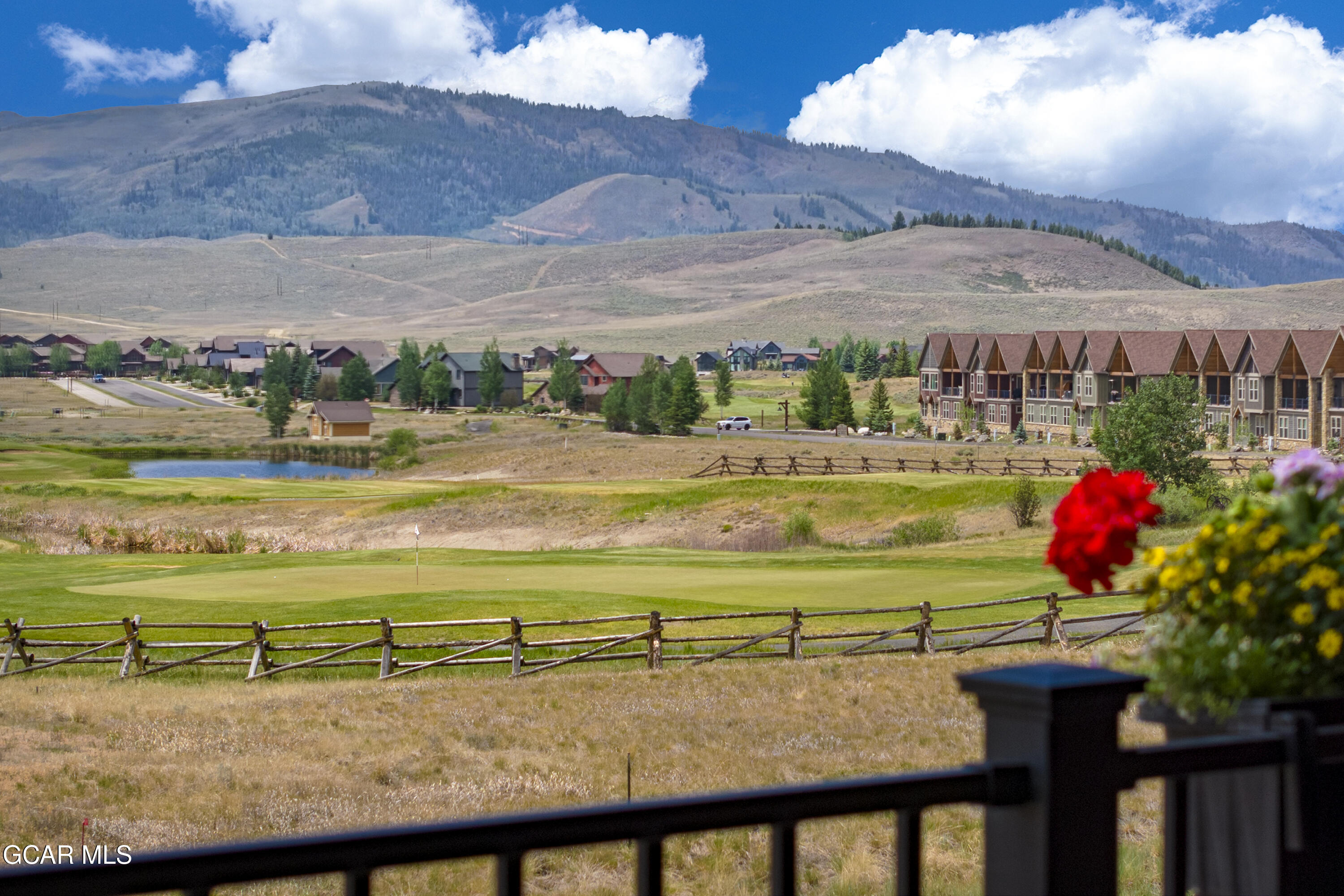 154 Eagle Ridge Drive Granby, CO 80446 - Photo 2 of 59 a view of a swimming pool with a table and chairs