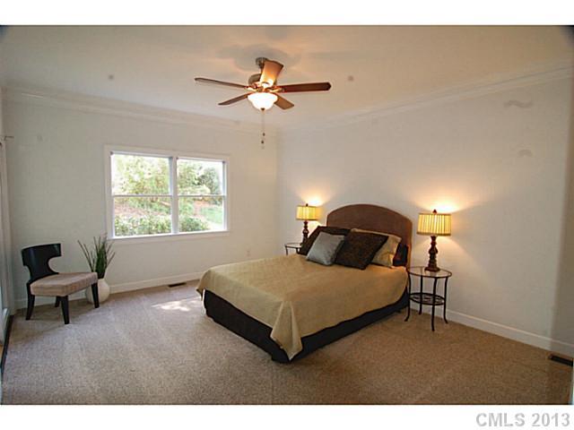 17516 Springwinds Drive Cornelius, NC 28031 - Photo 6 of 14 a bedroom with a bed and window