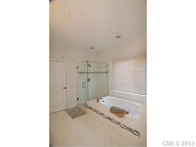 17516 Springwinds Drive Cornelius, NC 28031 - Photo 7 of 14 a bathroom with a sink and a shower