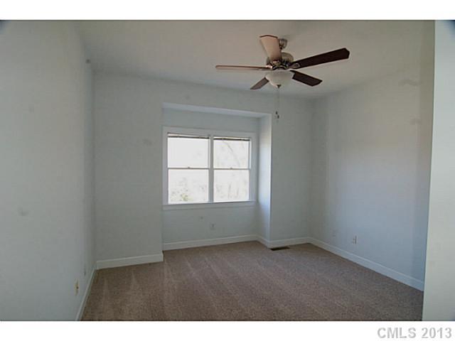 17516 Springwinds Drive Cornelius, NC 28031 - Photo 10 of 14 a view of an empty room with a window