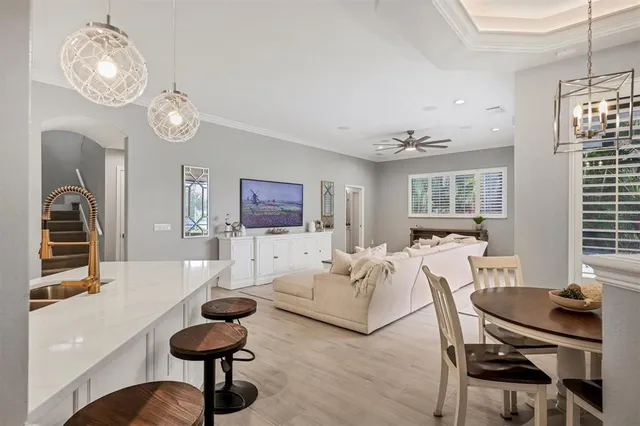 a dining room with furniture and window