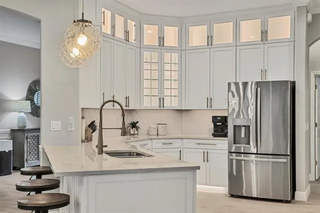 a living room with furniture and view of kitchen