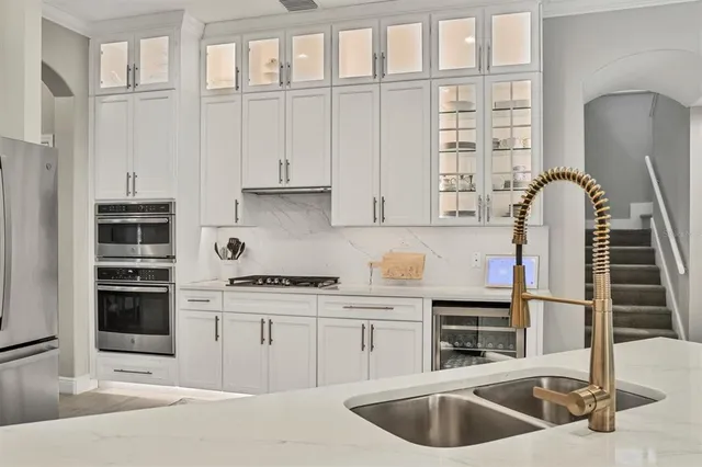 a bedroom with a large bed and a dresser