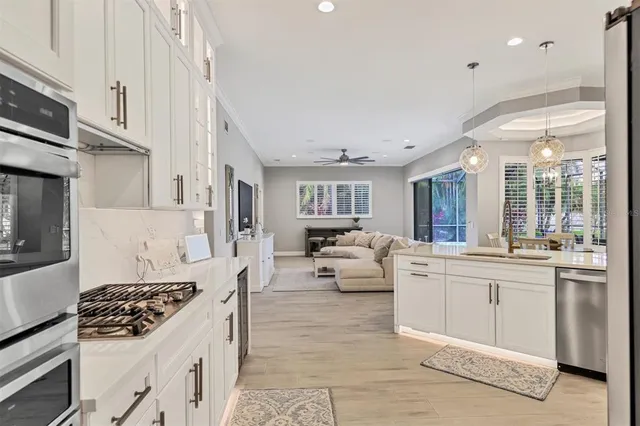 a view of a livingroom with workspace and a window