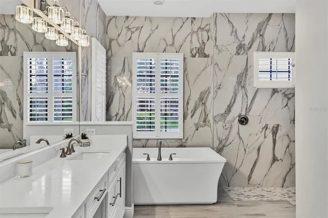 a living room with furniture a ceiling fan and a rug