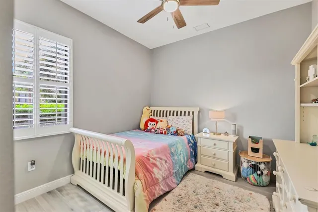 a view of a house with a yard and a tree