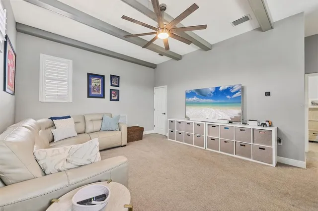 an aerial view of residential houses with outdoor space and river