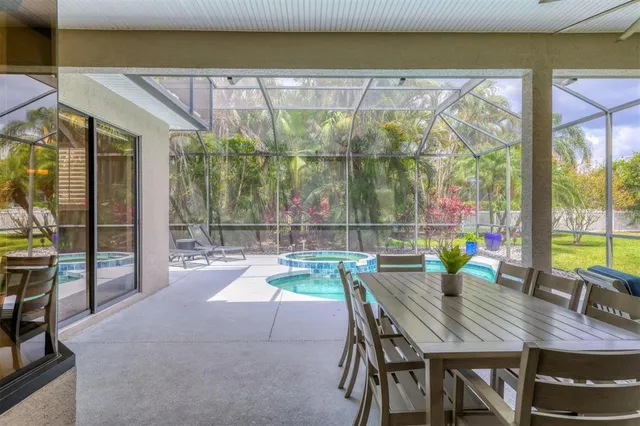 a sign that is sitting in front of a tree