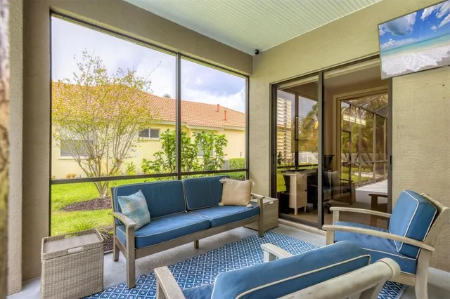 a view of a balcony with wooden floor and fence