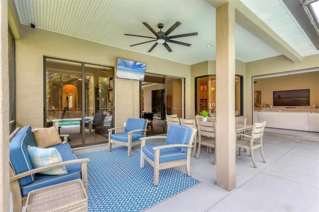 an aerial view of residential building with outdoor space and trees