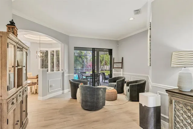 a view of a dining room with furniture and window