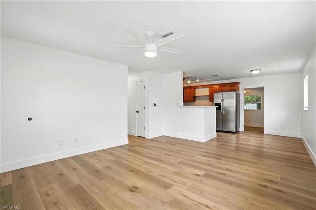 1336 Highlands Drive Naples, FL 34103 - Photo 4 of 17 wooden floor in an empty room