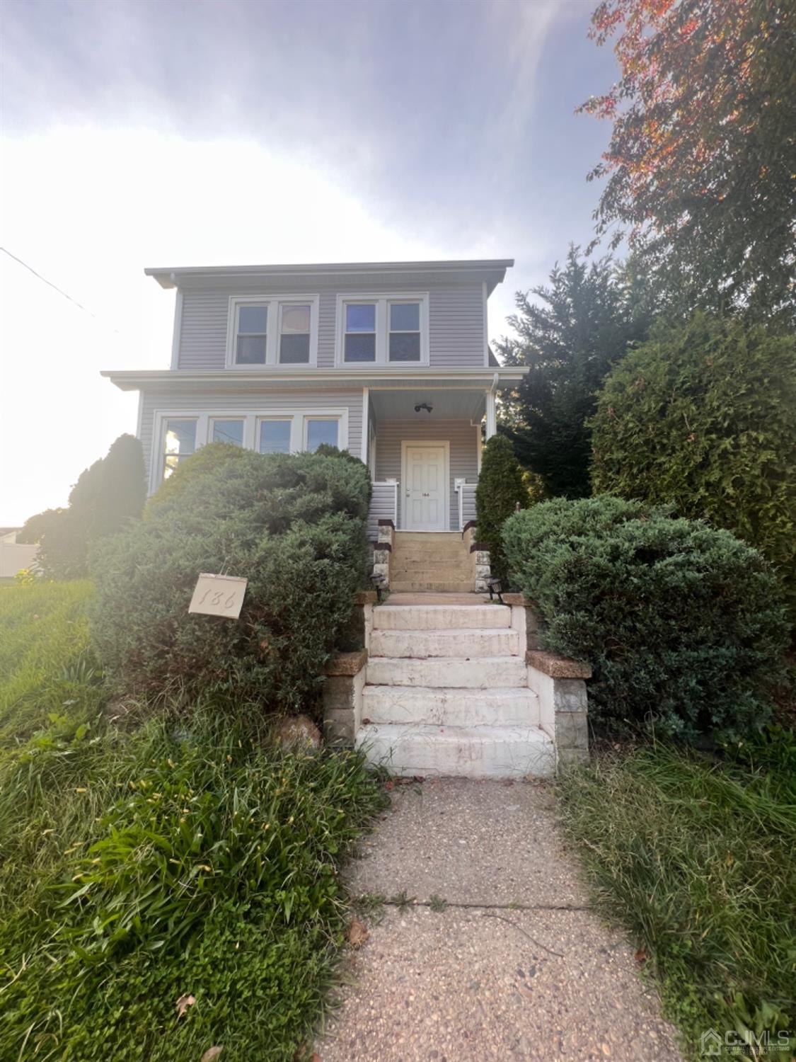186 Old Road Sewaren, NJ 07077 - Photo 1 of 7 a front view of a house with a yard