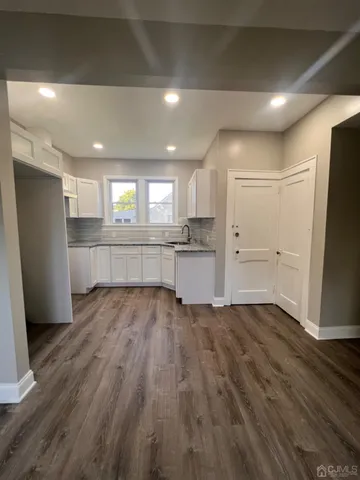 a view of room with window and front door
