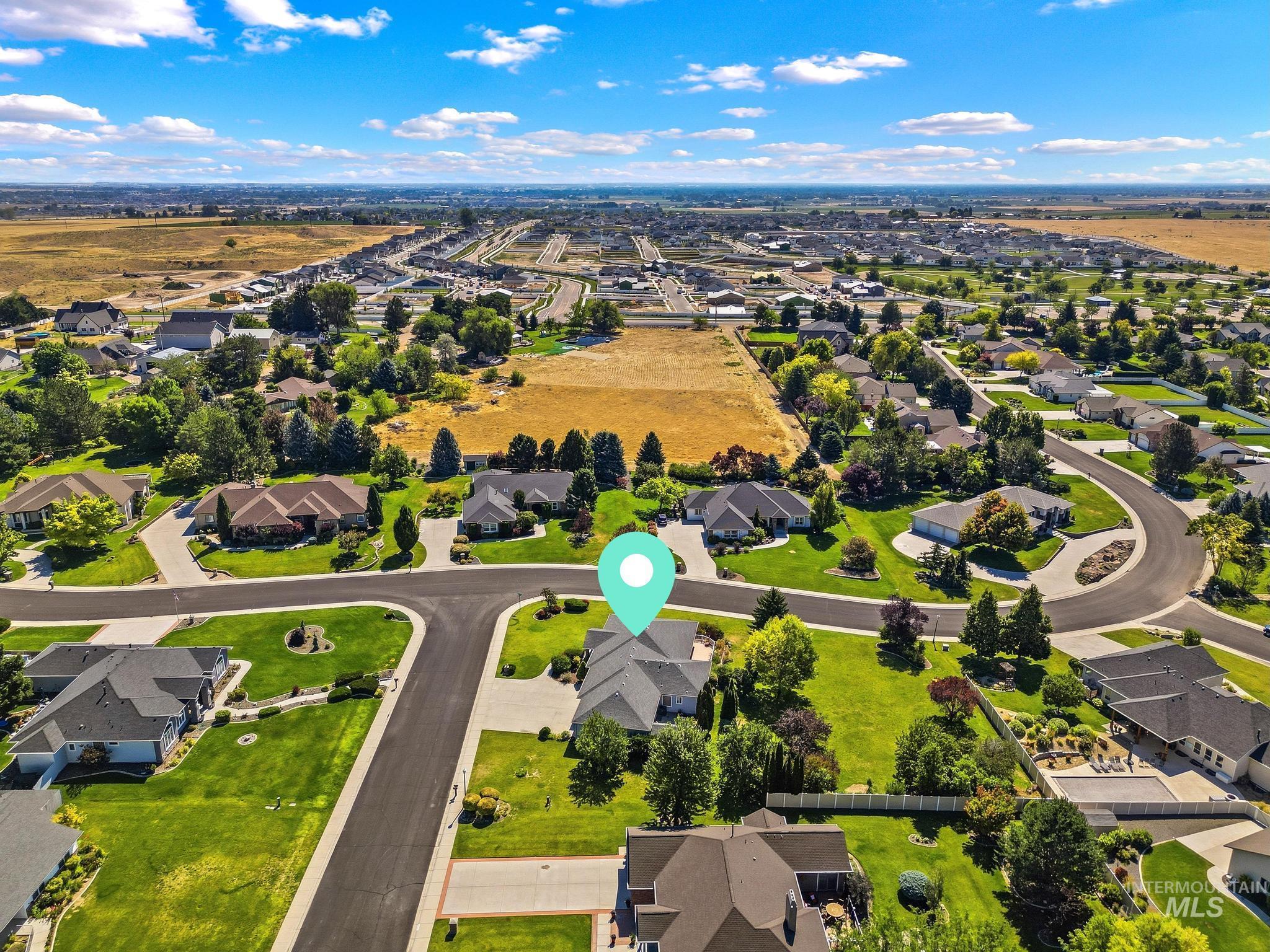15181 Drury Way Caldwell, ID 83607 - Photo 43 of 49 Aerial perspective featuring a residential area with manicured lawns and mature trees