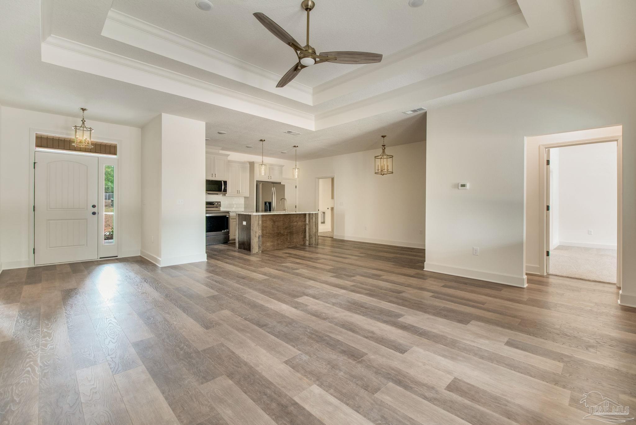 4310 Watkins Street Pace, FL 32571 - Photo 20 of 58 a view of a livingroom with wooden floor
