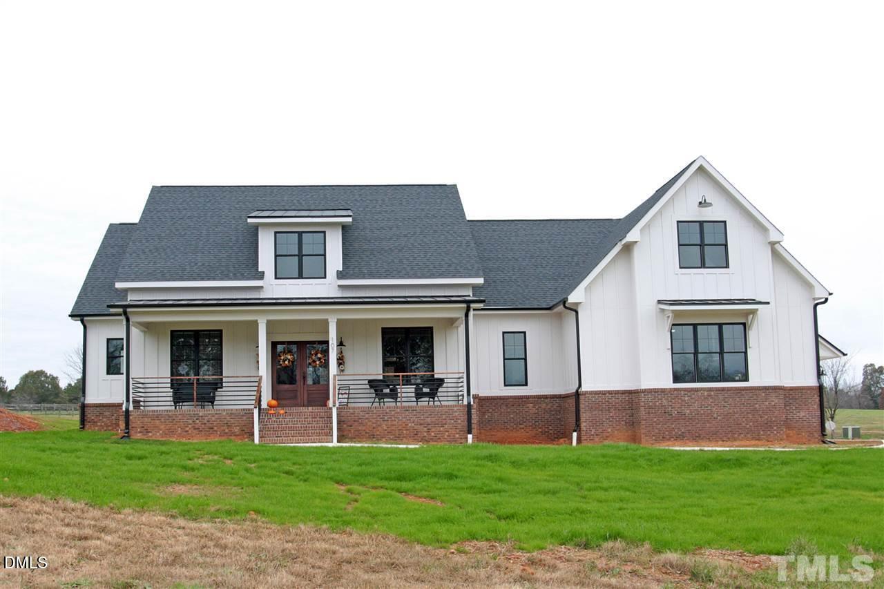 107 Cres Hill Lane Rougemont, NC 27572 - Photo 1 of 28 a house view with a garden space