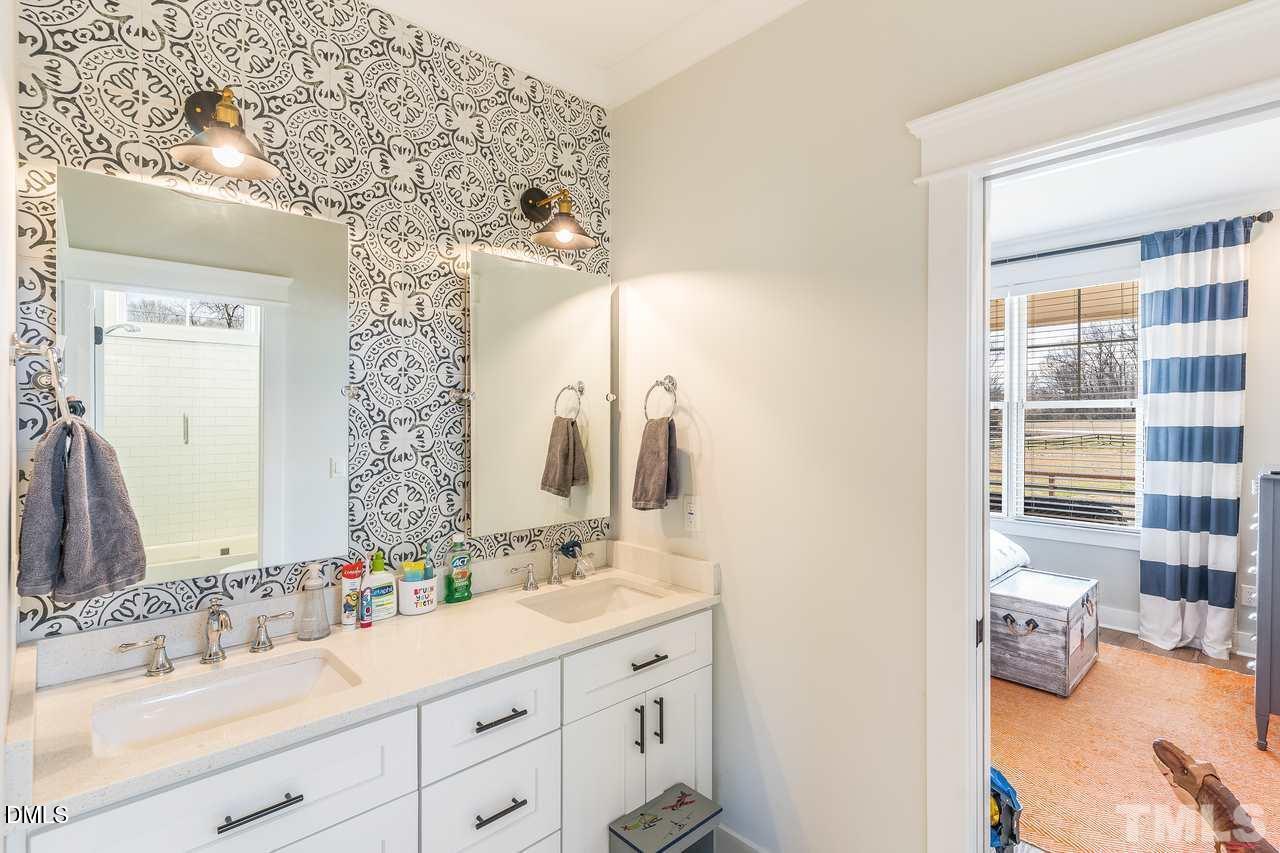 107 Cres Hill Lane Rougemont, NC 27572 - Photo 21 of 28 a bathroom with a double vanity sink mirror and