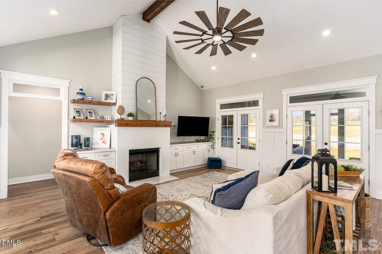 107 Cres Hill Lane Rougemont, NC 27572 - Photo 5 of 28 a living room with furniture fireplace and flat screen tv