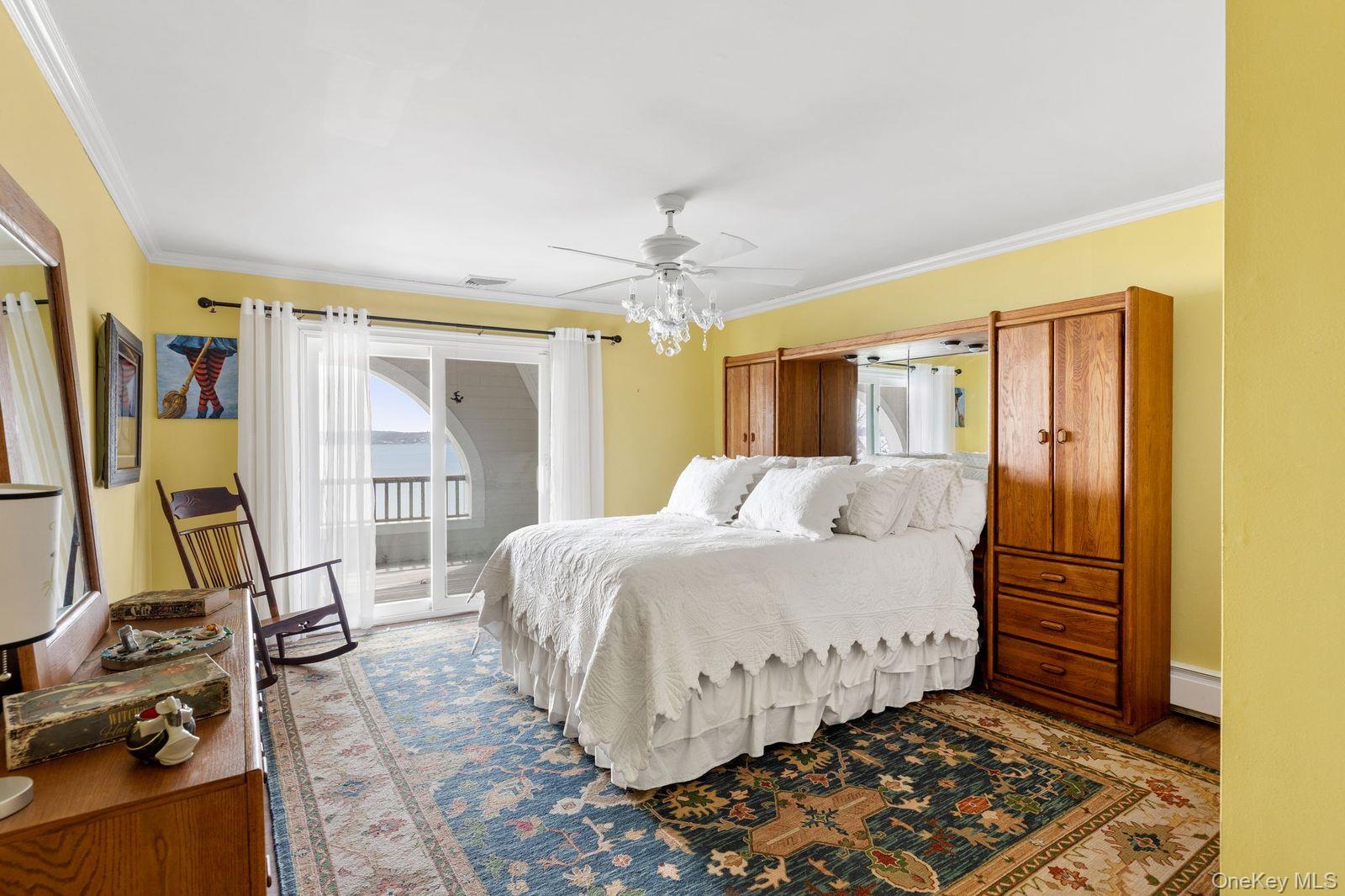 33 Beach Road Northport, NY 11768 - Photo 26 of 50 a bedroom with a bed and a mirror