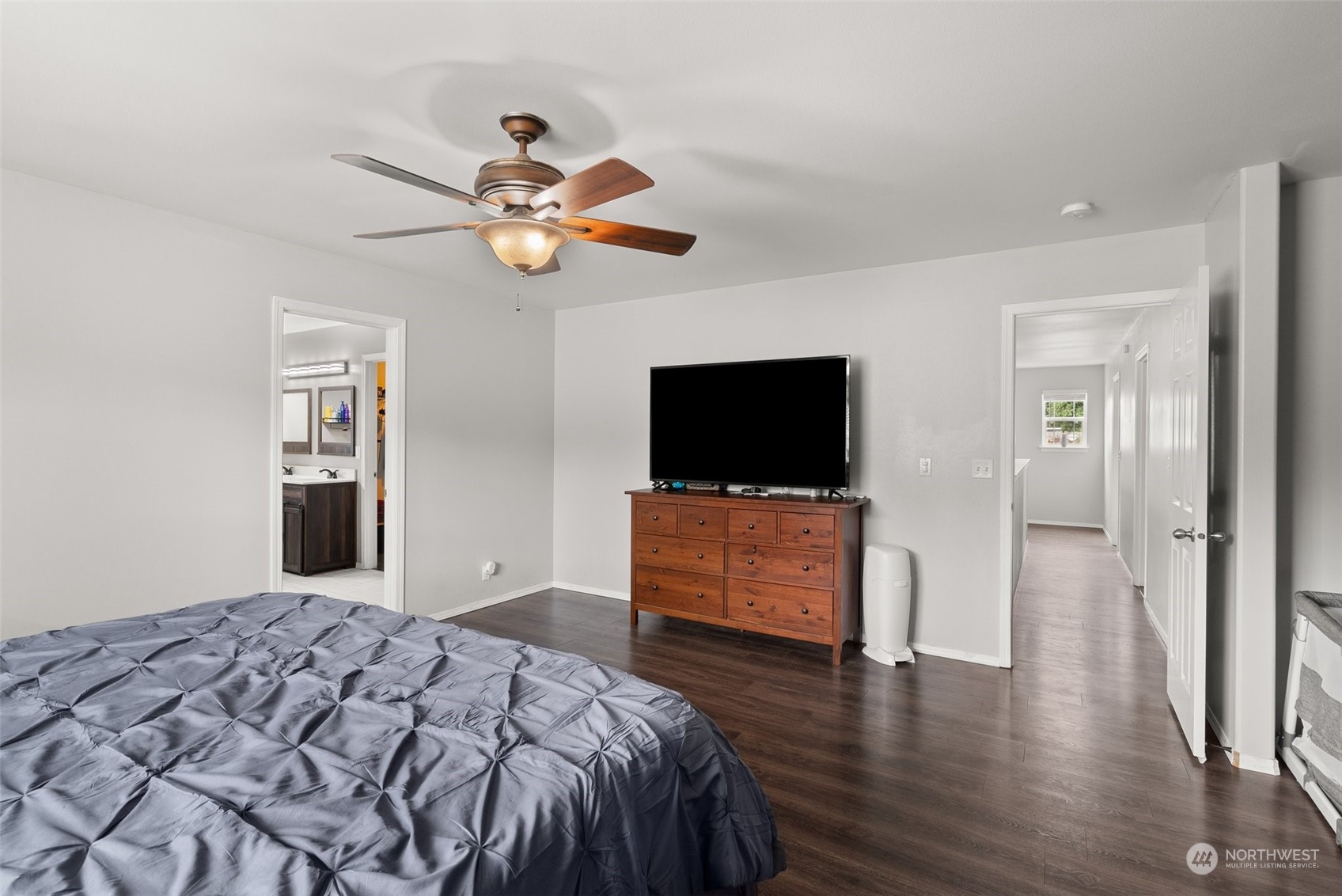 413 Easy Street Rainier, WA 98576 - Photo 15 of 30 a bedroom with a bed and a flat screen tv