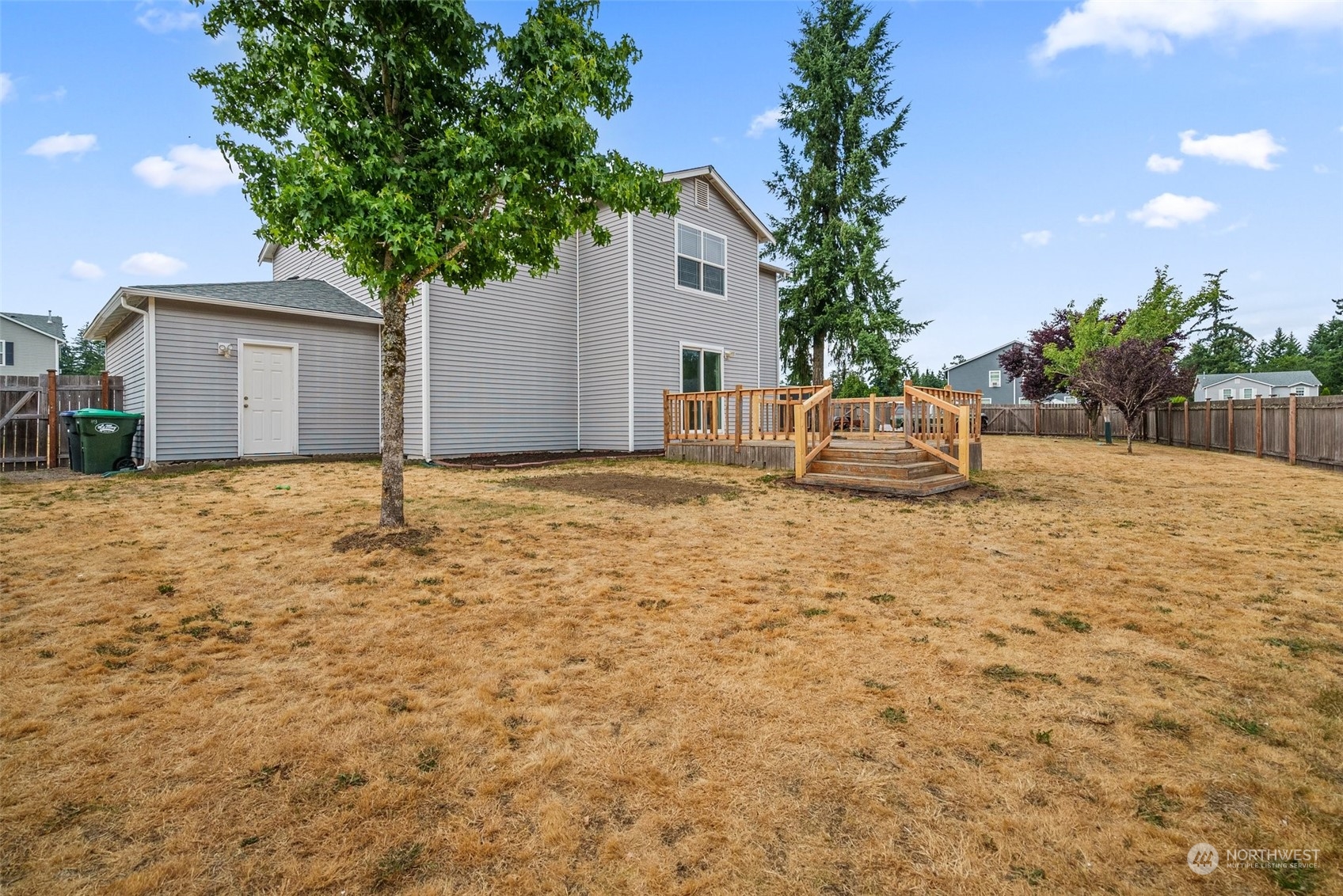 413 Easy Street Rainier, WA 98576 - Photo 28 of 30 a backyard of a house with table and sofas