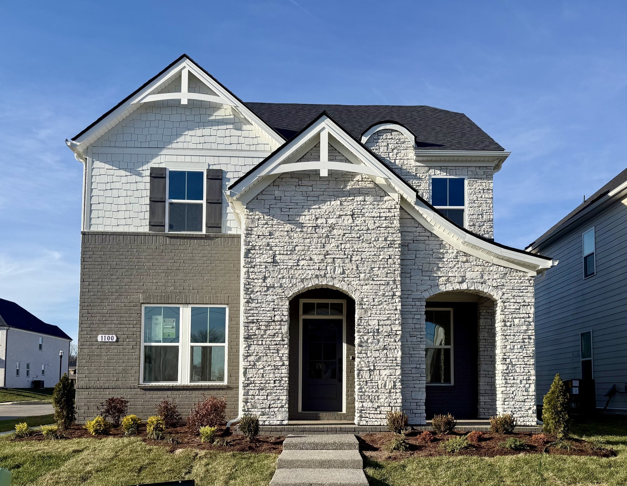 a front view of a house with garden