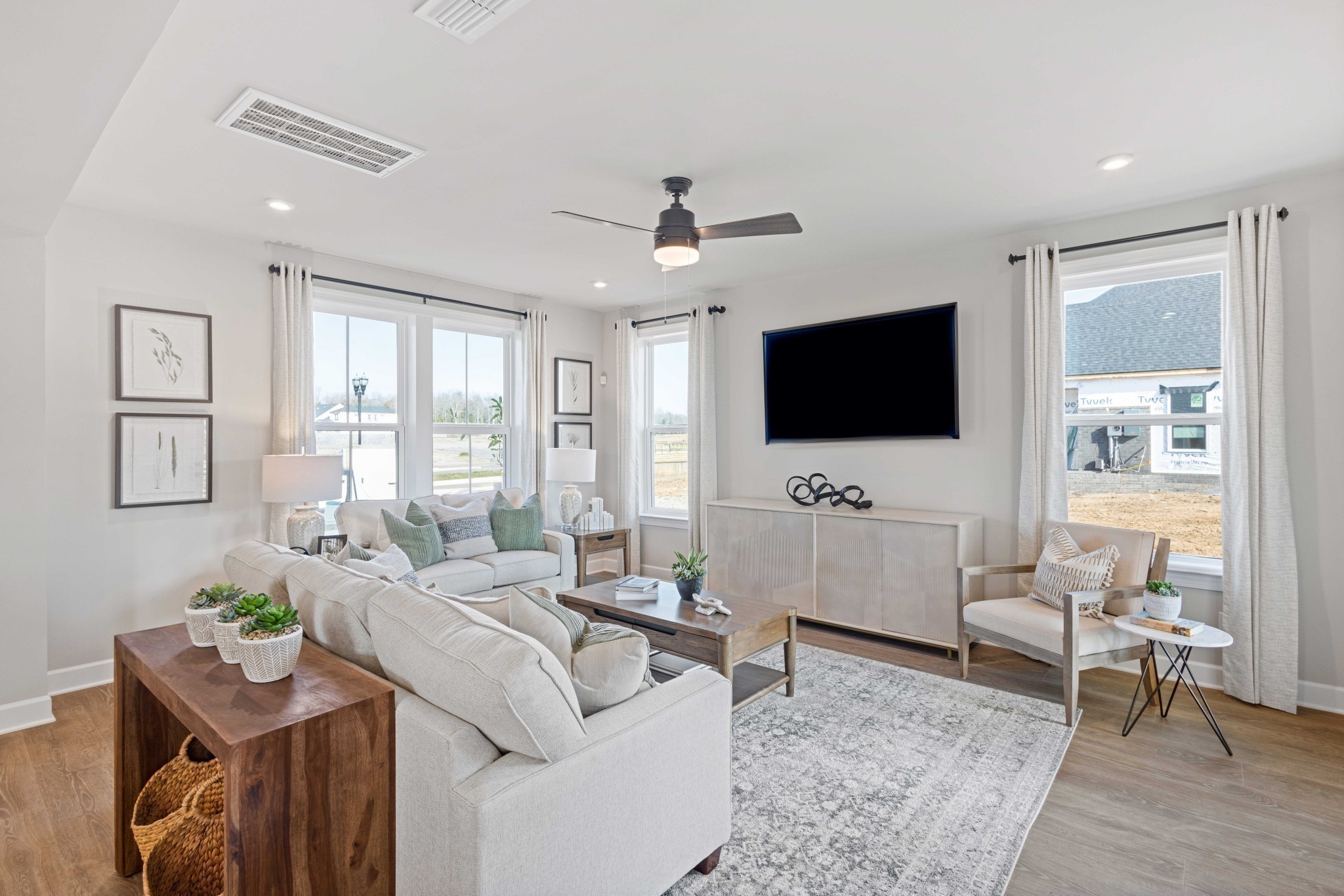 2025 Holbrook Road Mount Juliet, TN 37122 - Photo 8 of 24 a living room with furniture a flat screen tv and a large window