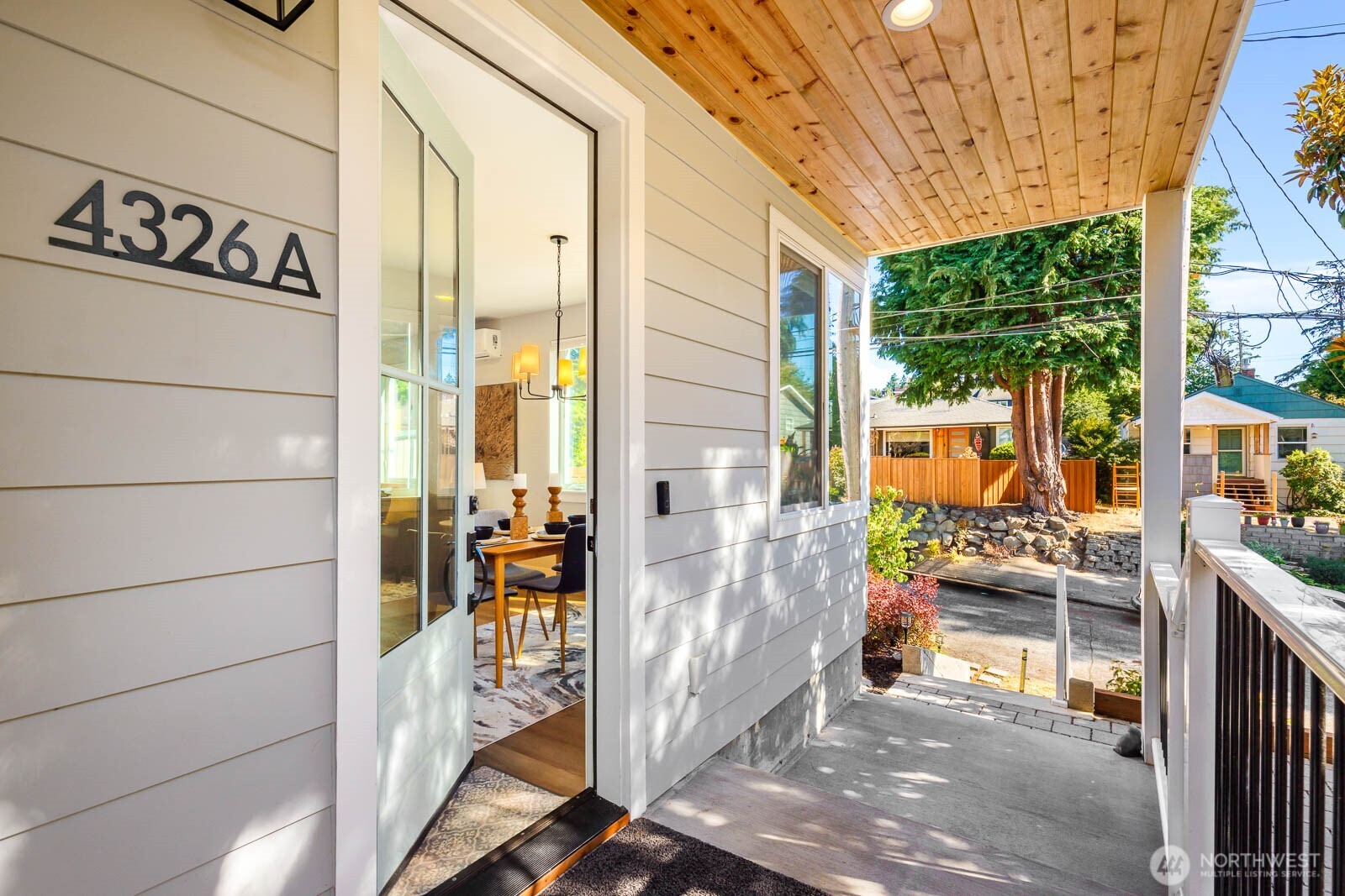 4326 Southwest Mills Street Seattle, WA 98136 - Photo 3 of 37 a view of a porch with furniture