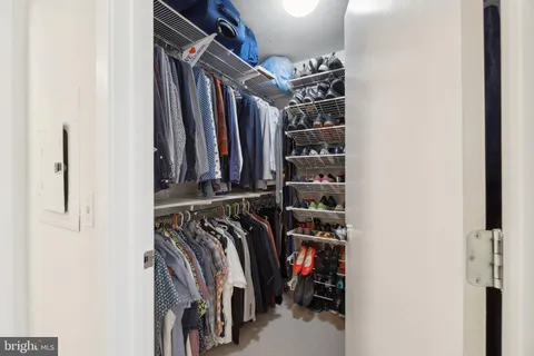 a bedroom with a bed and a cabinets