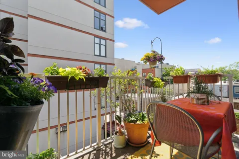 a view of a workspace with furniture and a workspace