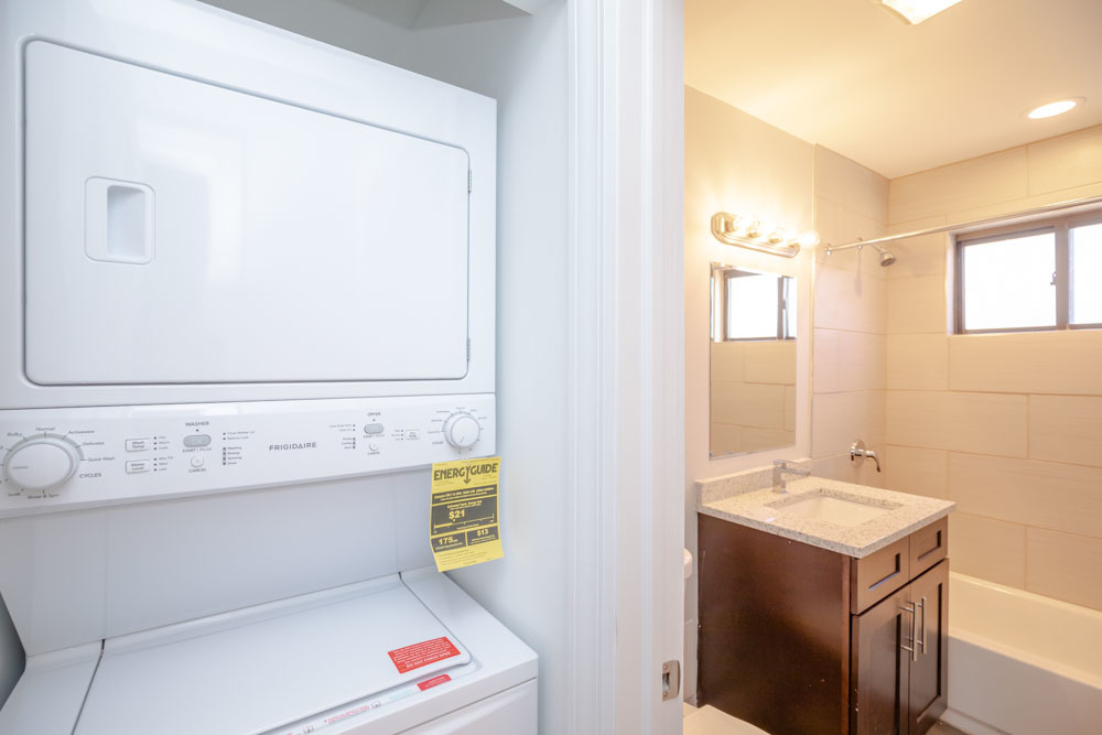6807 North Ridge Boulevard, Unit 101 Chicago, IL 60645 - Photo 7 of 13 a bathroom with a sink and a mirror