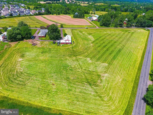 a view of a swimming pool with an outdoor space and seating area