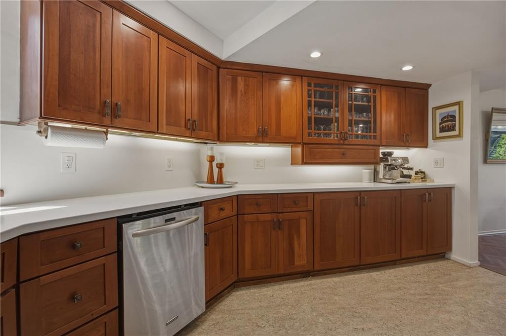 5535 Forbes Avenue, Unit E Pittsburgh, PA 15217 - Photo 11 of 50 a kitchen with stainless steel appliances granite countertop wooden cabinets a sink and dishwasher
