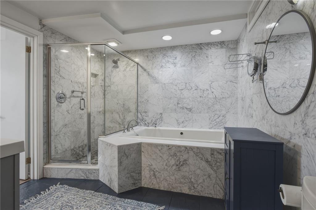 5535 Forbes Avenue, Unit E Pittsburgh, PA 15217 - Photo 19 of 50 a bathroom with a tub a sink and a shower